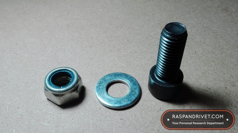 The 14mm cap screw with matching washer and lock nut for attaching the angle grinder backing plate to the Bosch.