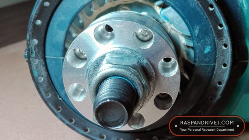 The adaptor secured to the Bosch 5 inch random orbit sander with four 4mm stainless steel button-head cap screws.