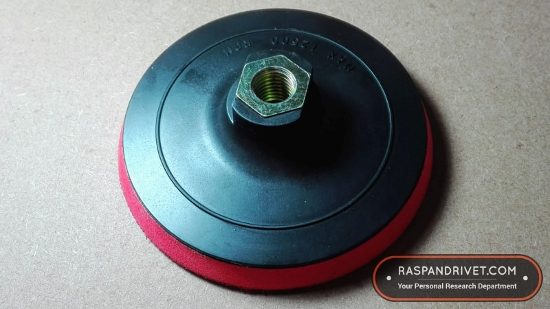 The back of the cheap angle grinder backing plate.